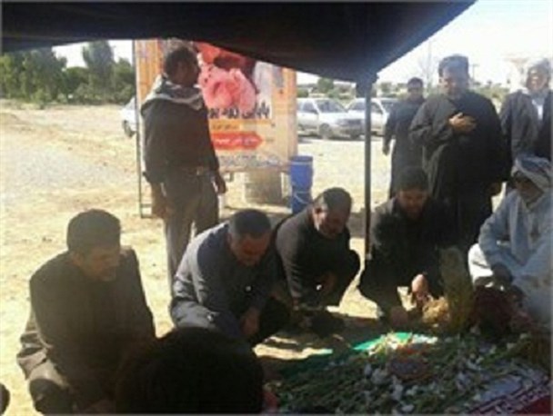 استاندار خوزستان بر سر مزار شهید مدافع حرم "نادر حمید"+عکس