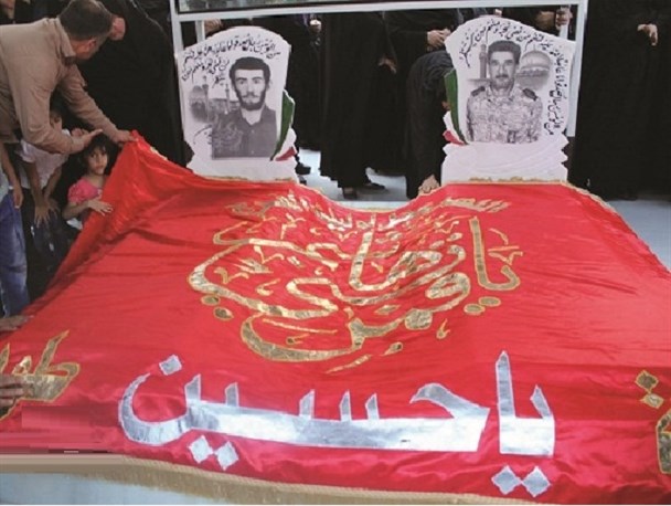 اهتزاز پرچم گنبد امام حسین(ع) بر فراز مزار شهید مدافع حرم در باغملک+تصاویر