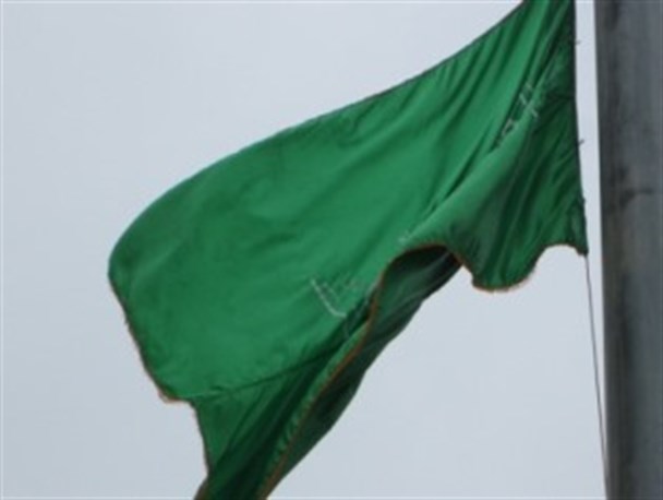 تصاویر/نصب پرچم متبرک به حرم امام رضا (ع) در میدان سرخواجه گرگان
